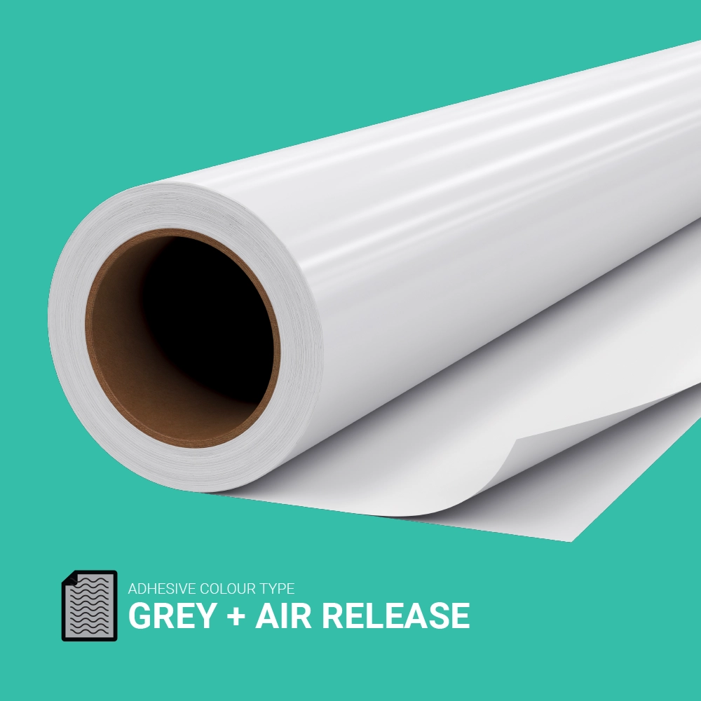 Roll of grey-backed air release self-adhesive vinyl on a teal background, ideal for smooth bubble-free application