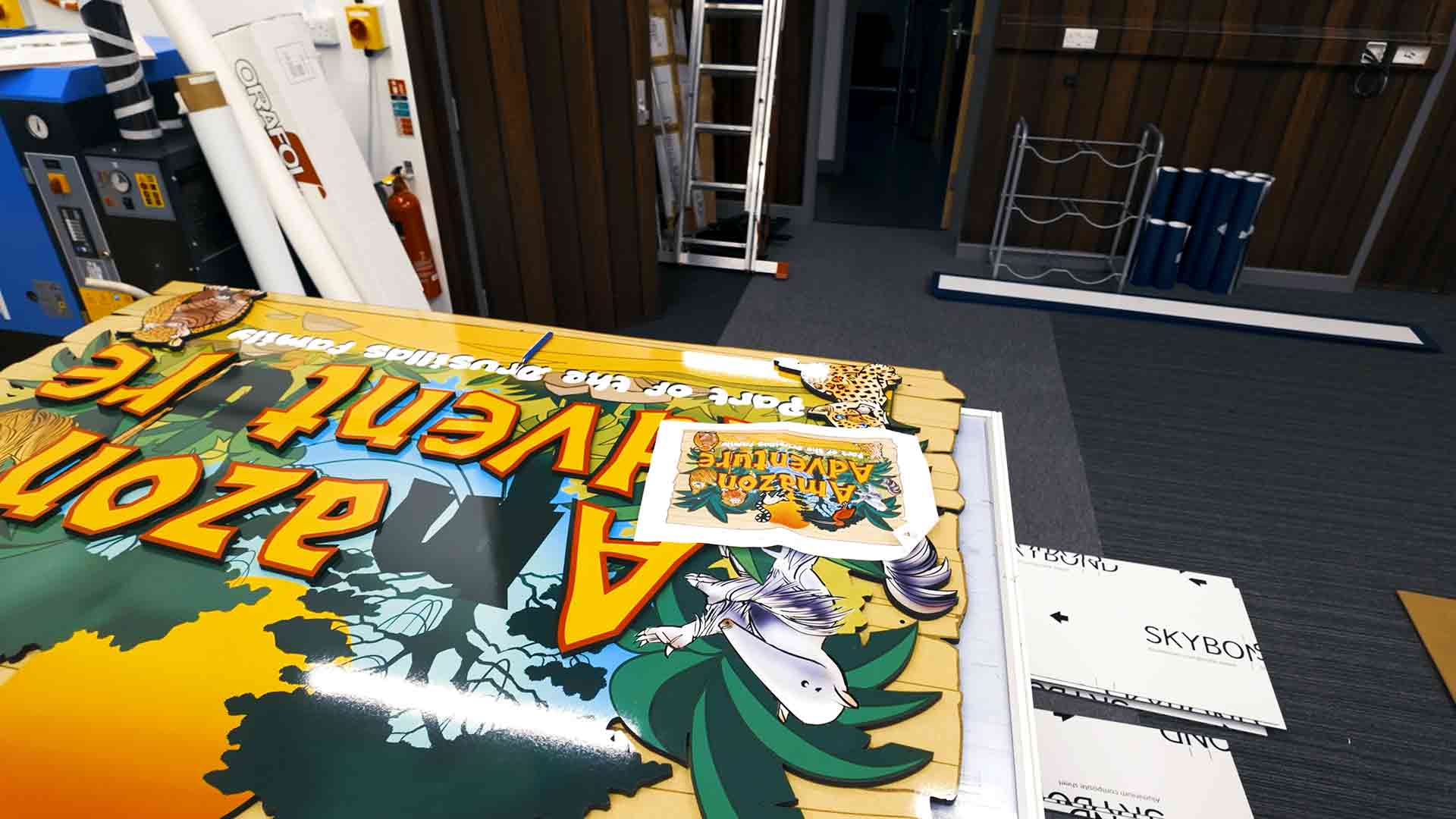 Printed panels for the “Amazon Adventure” sign stacked and prepared for assembly at Beautiful LFP’s production studio.