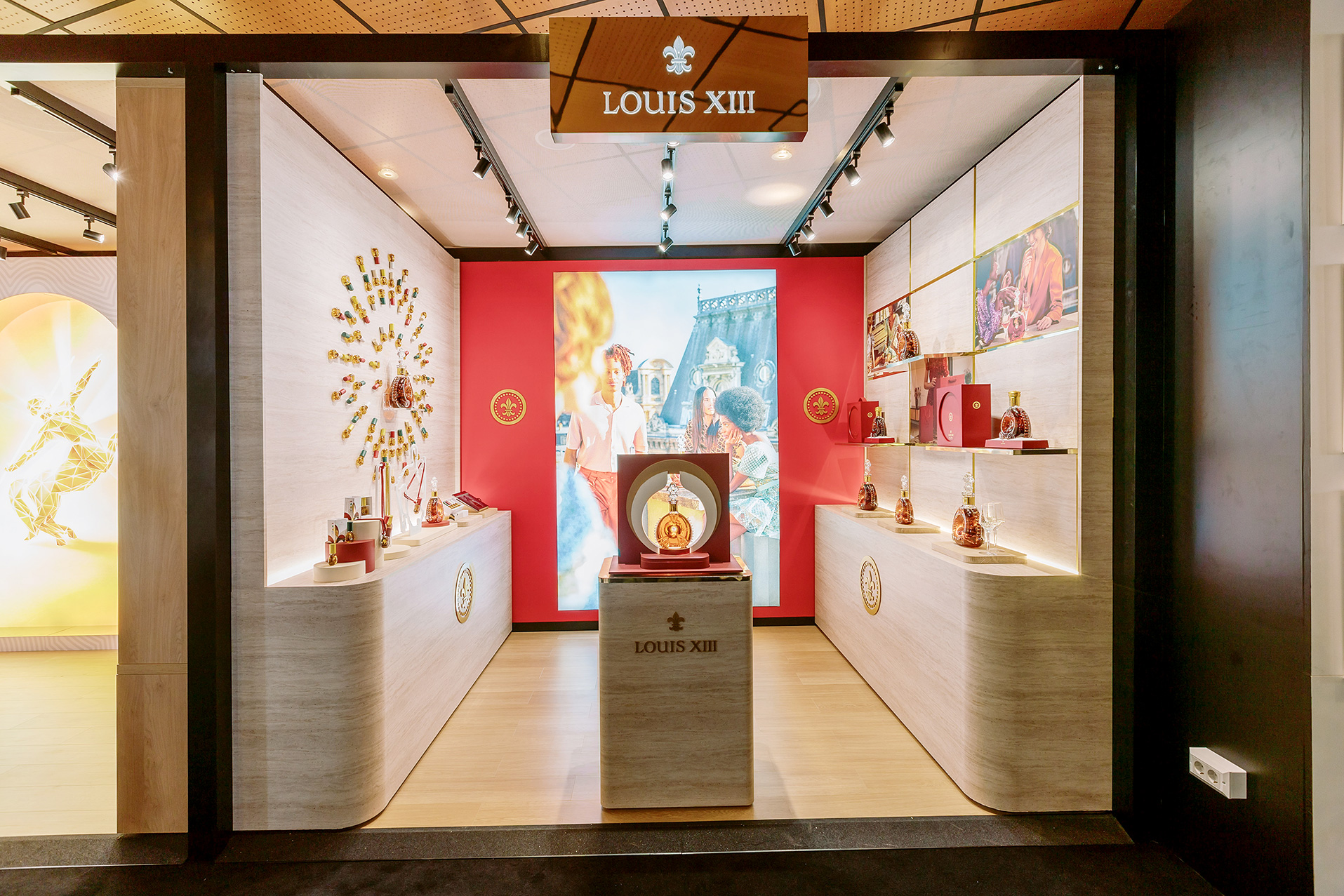Louis XIII exhibition stand with luxury display cases and illuminated branding produced by Beautiful LFP for Rémy Cointreau at the Cannes showcase.