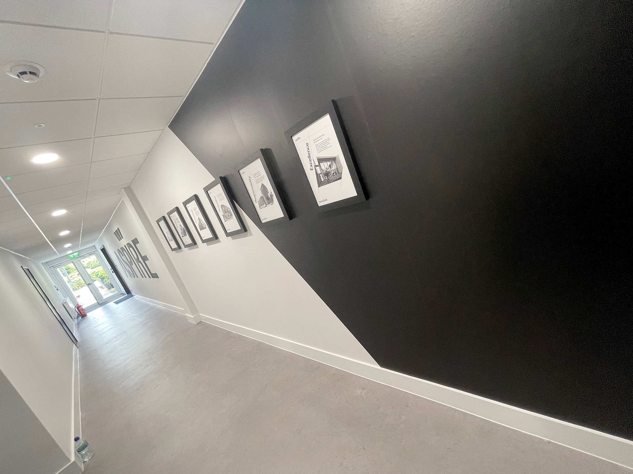 Schüco UK office interior branding installation in Milton Keynes featuring large format wall graphics and premium vinyl finishes